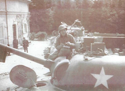 photo of Don Tang sitting on a tank