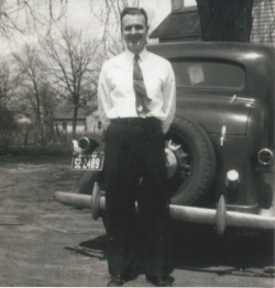 Leo Hein standing in front of a car