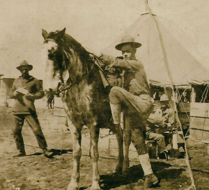 photo of John Wagner in uniform by horse