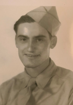 Joseph Jenn smiling wearing his Army uniform
