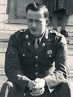 Neal Gorman sitting on stairs wearing his Army uniform