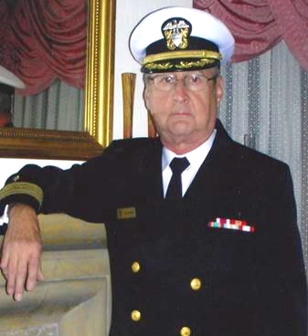 Peter Jochimsen years later in full Navy gear with is arm on a fireplace