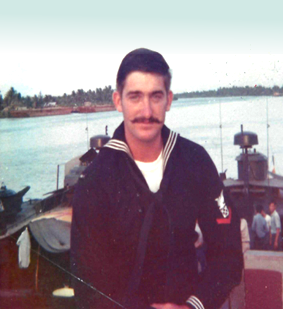 Robert Jenn on a Navy boat in uniform