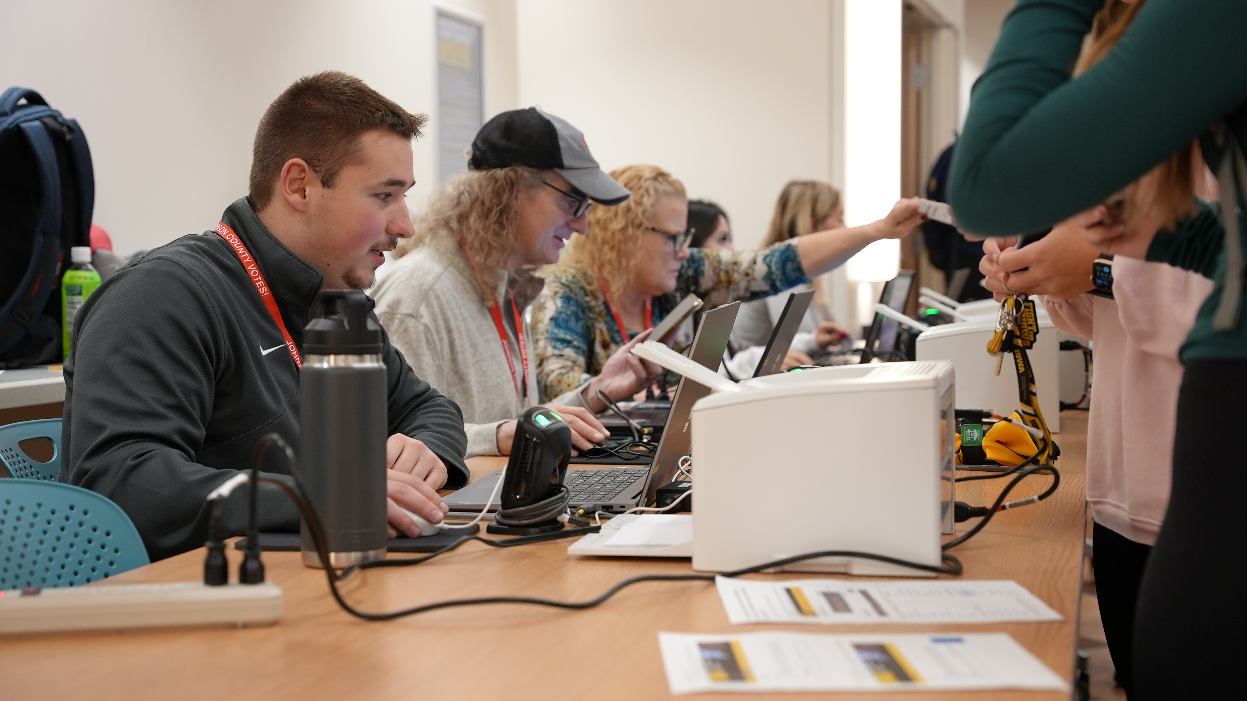 Pollworkers at computers