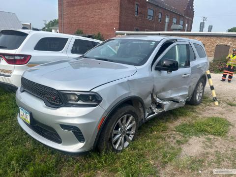 Photo of a Sheriff's Office patrol SUV with damage to the drivers side from being broadsided in a crash.