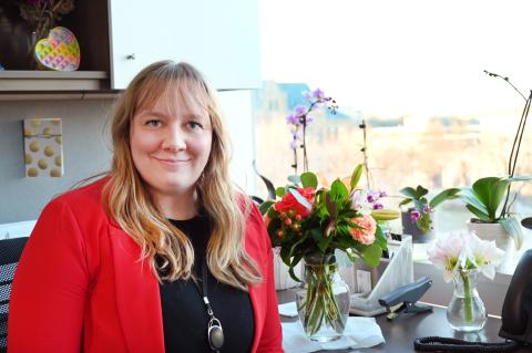 Assistant County Attorney Haley Huddleston sits at her desk.